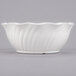 A white Cambro polycarbonate bowl with a wavy swirl design.