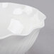 A close-up of a white Cambro Camwear swirl bowl.