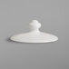 A white porcelain coffee pot lid with a round knob on a white surface.