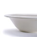 A close-up of a 1.25 Qt. white porcelain serving bowl.