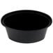 A black oval plastic souffle container with a lid.