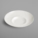 A white porcelain plate with a curved edge.
