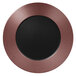 A circular bronze and black porcelain plate with an embossed design.