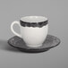 A RAK Porcelain beech grey espresso cup and saucer with white and black accents.