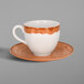 A white porcelain coffee cup and saucer with a brown rim.