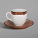 A RAK Porcelain Woodart walnut brown and white porcelain espresso cup and saucer.