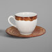A RAK Porcelain Timber Brown and White coffee cup and saucer with a brown spot.