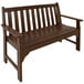 A brown POLYWOOD Vineyard bench with armrests.