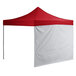 A red tent with white fabric walls.