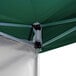 A green Backyard Pro instant canopy with metal poles and white fabric.