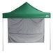 A green tent with a white cover.
