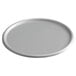 A round white lid on a round silver tray.