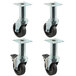 Four black swivel casters with rubber wheels.