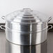 A Town aluminum steamer cover on a large silver pot.