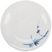 A white plate with blue and white bamboo design.