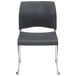 A charcoal National Public Seating stack chair with chrome legs.