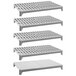 A white rectangular Cambro Camshelving kit with four vented and one solid plastic shelves.
