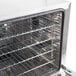 A Galaxy stainless steel oven rack inside a Galaxy countertop convection oven.