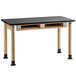 A black and wood National Public Seating science lab table with a black top.