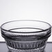 A close up of a Libbey Winchester clear glass ramekin with a rim.
