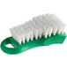 A green Thunder Group cutting board brush with white bristles.