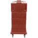 A red Cambro Ultra Camcart for food pans.