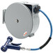 A T&S grey metal hose reel with a blue cap attached to a hose.