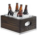 A Cal-Mil Cinderwood ice housing with bottles of beer in it.