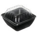 A black plastic container with a clear lid on it.