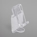 A clear plastic Snap Drape table skirt clip with hook and loop attachment.