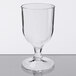 A clear GET SAN plastic goblet on a table.