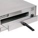 A Nemco countertop pizza oven with a metal handle.
