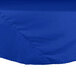 A royal blue table cover with a white hem on a table.