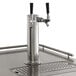 An Avantco stainless steel beer tap with two silver metal taps.