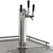 A black Avantco beer dispenser with a silver triple tap.