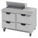 A stainless steel Beverage-Air refrigerated sandwich prep table with four drawers.