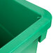 A close up of a green Continental rectangular wall hugger recycle bin.