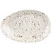 A white oval Elite Global Solutions melamine plate with black specks.