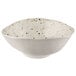 An oval white melamine bowl with speckled chocolate chip design.