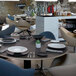 A table set with Villeroy & Boch black shale porcelain plates and silverware.