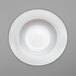 A Villeroy & Boch white bone porcelain plate with a circular swirl pattern.