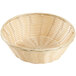 A Thunder Group natural-colored round rattan basket with a handle.