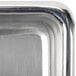 A close-up of an American Metalcraft stainless steel square sauce cup.