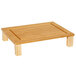A GET Enterprises bamboo half size solid cutting board on a rectangular wooden table.