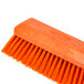 An orange Carlisle Sparta Omni Sweep brush head with unflagged bristles.