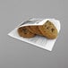 A stack of cookies in a Get Enterprises French newsprint wrapper.