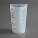 A white Tablecraft flexible silicone 3-sided measuring cup with black numbers on it.