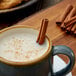 Regal bulk cinnamon sticks in a cup of hot coffee.