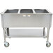 An APW Wyott stainless steel three pan exposed portable steam table on a counter in a school kitchen.