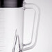 A Waring polycarbonate blender jar with clear lid and blade.